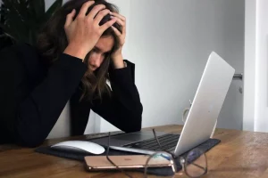 businesswoman frustrated with laptop computer